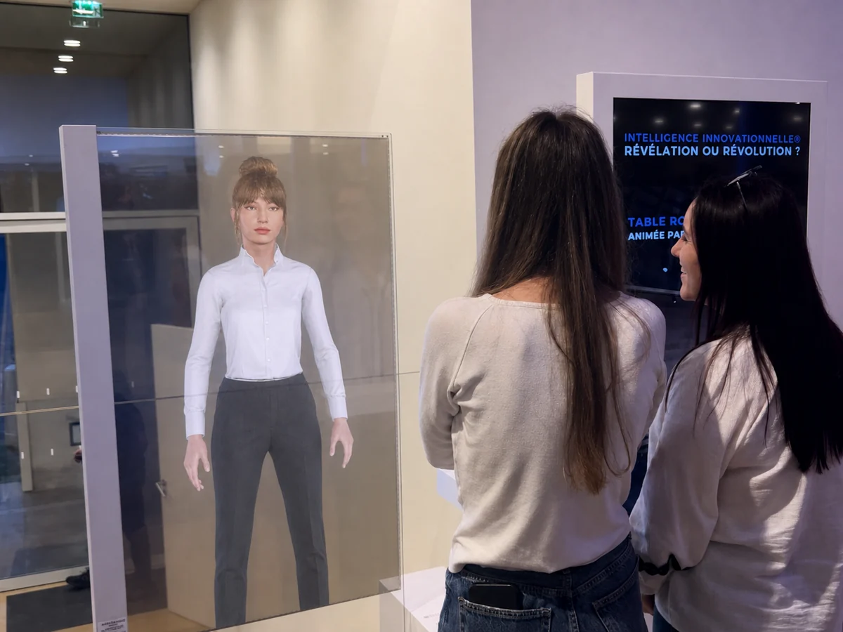 Laura, a digital host, interacting with visitors through a transparent display in a reception area.